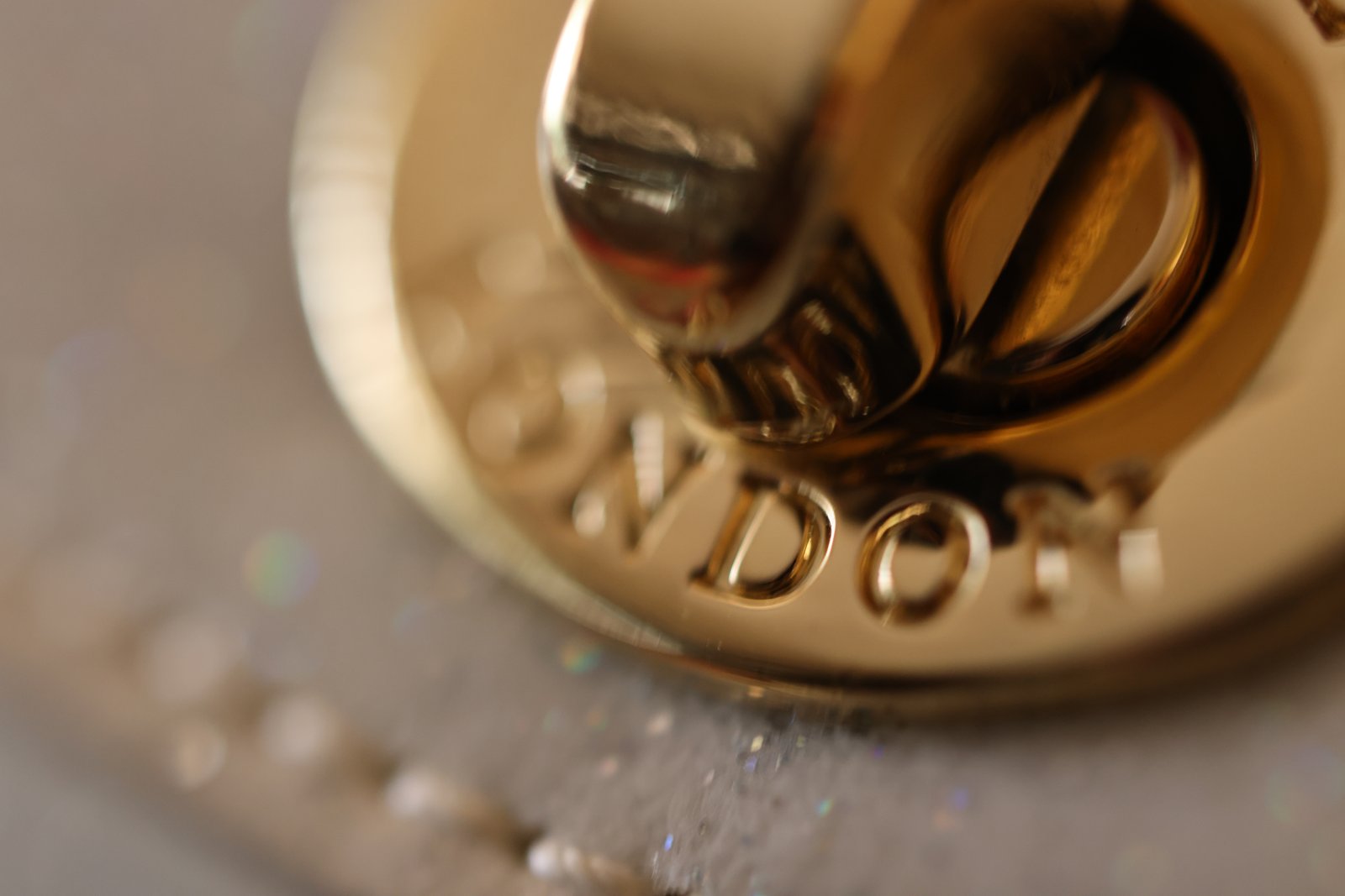 Gold Pandora clasp macro — cinematic brand film
