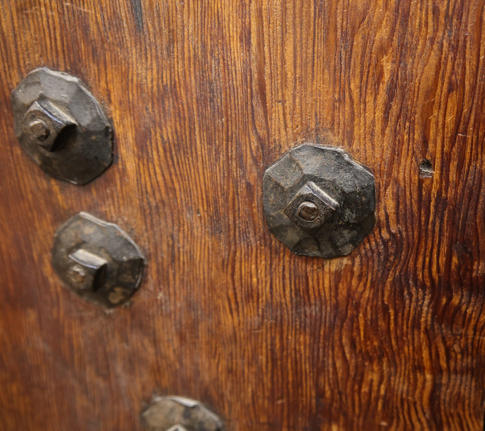 Spotlight — hand-forged bolts on wood, proof of craftsmanship