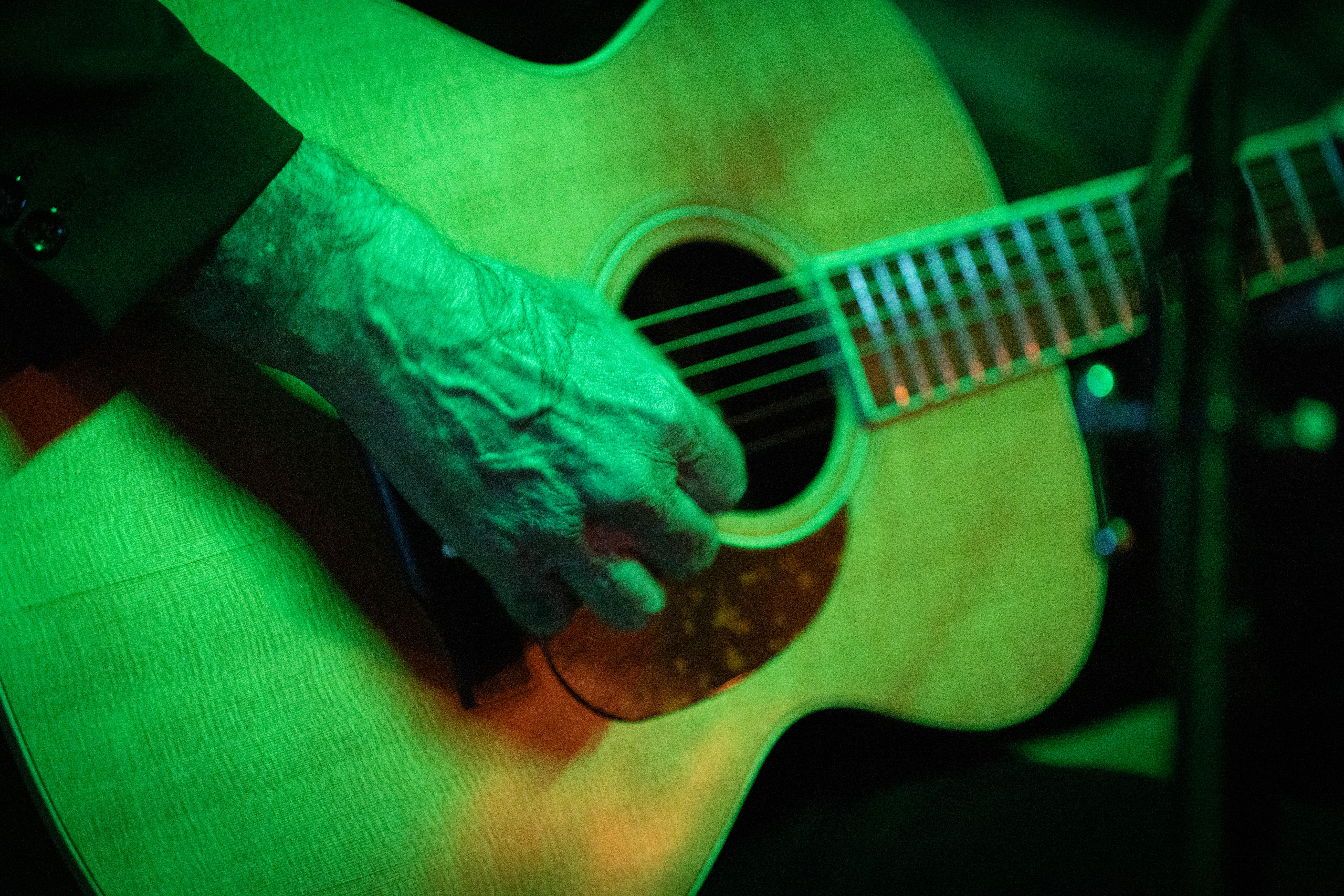 Guitar body and hands detail
