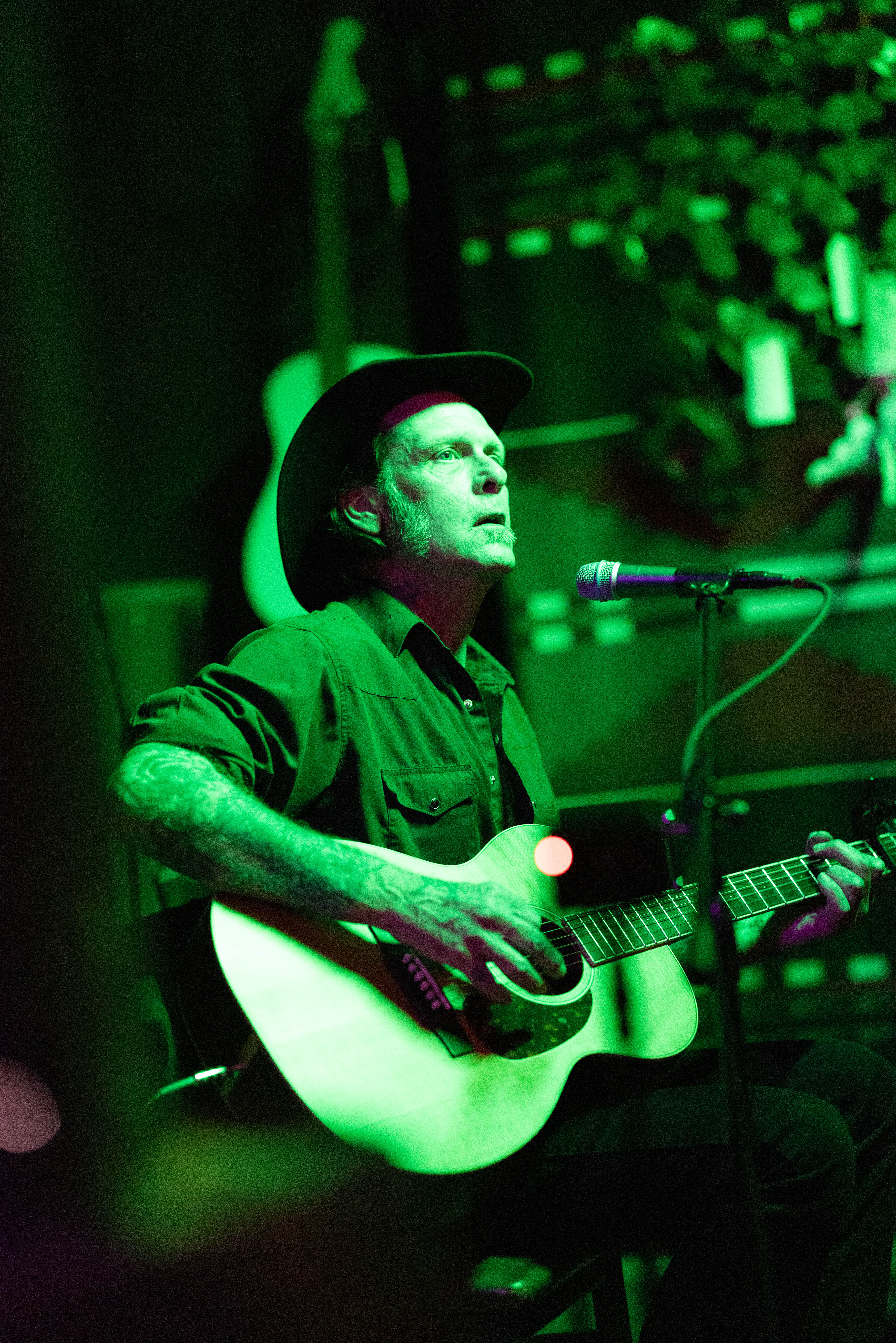 Commanding stage presence under warm light